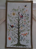 Full view of the Tree of Life tapestry showing entire embroidered design and border.