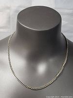 Front view of the 19.5-inch sterling silver necklace chain on a gray mannequin bust showcasing its full length and link style.