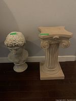 Overview photo showing both bust and pedestal placed on floor with tags.