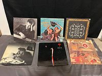 Six vinyl album covers displayed showing the collection in lot, including Billy Joel Greatest Hits and Styx album.