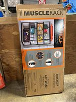 Close-up of box showing product name, shelving unit image, and capacity details.