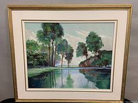 Full view of the framed oil on board landscape painting by George Carter, showing the entire artwork and frame with minor wear.