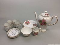 Photo showing full set of Rosenthal demitasse mugs, plates, Tuscan coffee pot, creamer, sugar bowl, and dessert plates.