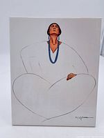 Frontal view of the artwork showing a stylized seated woman with white clothing and blue jewelry, signed by R. C. Gorman in the lower right corner.