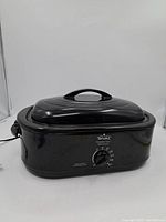 Black Rival vintage electric roaster oven with lid, temperature control knob and power cord.
