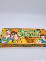 Photo showing the full game box with title and characters clearly visible on an orange background.