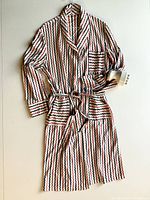 Front view of vintage lounging robe showing full length, shawl collar, three front pockets, and belt tied at waist.