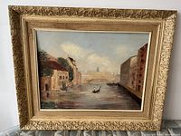 Full view of the oil painting framed showing the Venetian canal scene with gondoliers and architectural backdrop.
