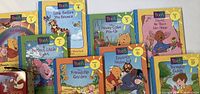 Photo of 7 Winnie the Pooh learning books and Parents Guide laid out, including colorful illustrated covers with familiar characters Pooh, Piglet, Eeyore, and others