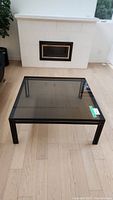 Front view of square coffee table in room