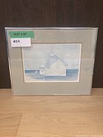Frontal view of the "Light Side" framed art print showing the minimalist architectural design in blue and white.