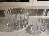 Two Orrefors crystal bowls on kitchen counter, showing size difference and faceted design.