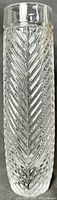 Front view of the clear crystal vase showing detailed herringbone pattern running vertically with a cylindrical shape and flat bottom.