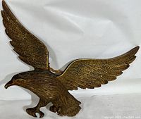 Full view of the solid brass eagle wall hanger with wings spread, showing overall condition and size.