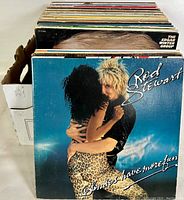 Photo of stack of vintage vinyl LP records showing Rod Stewart "Blondes Have More Fun" album cover in front