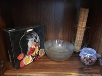 Image showing glass serving bowl, glass pitcher, grass table runner, and a small bowl filled with potpourri.