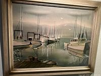 Framed airbrush watercolor of harbor scene showing several moored boats, dock in foreground