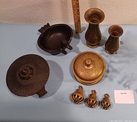 Full lot with 2 vases, lidded container, 3 bells, duck ashtray, and lantern base visible
