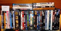 Photo of the collection of DVD movies showing titles including the Lord of the Rings Trilogy and other various movies.