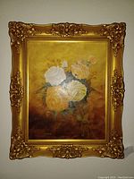 Full view of framed oil painting of flowers with gold ornate frame