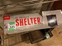 Photo of the Zodi XL Privacy Shelter box showing product branding and size designation.