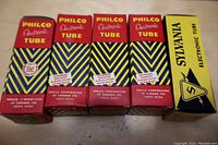 Front view of 5 original boxes including 4 Philco and 1 Sylvania electronic tubes in new old stock condition.