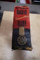 Original box for Westinghouse radio transmitting tube, black and red with worn condition.