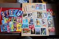 Photo shows a variety of colorful cards laid out on a table including Lego, Disney characters, and other illustrated and photograph-based cards.
