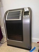 Front and side view of Lasko movable air heater showing grill and overall design.