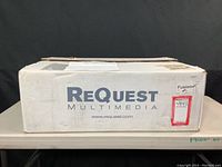 White ReQuest Multimedia cardboard box labeled Fusion.