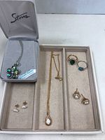 Full lot view showing all jewelry pieces including 2 necklaces, 2 pairs earrings, and 2 rings.