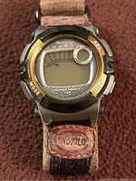 Front view of Mens Armitron digital watch with fabric strap