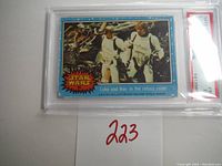 Front side view of the 1977 Star Wars card featuring Luke and Han in the refuse room, card #38.