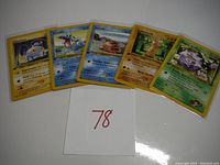 Five early Pokemon 1st edition cards including Chinchou, Totodile, Geodude, Venusaur, and Koga's Koffing displayed with lot number 78.