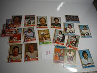 Overview of 18 hockey cards from 1974 O-Pee-Chee featuring various players including Gary "Suitcase" Smith and teammates with visible wear and age marks