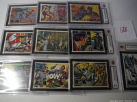 Photo showing all 10 Batman Black Bat Series 1 trading cards in graded protective cases arranged in rows, featuring Batman, Robin and villains.