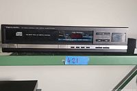 Front view of Realistic CD-2300 Compact Disc Digital Audio Player showing LED display, buttons, and open/close CD tray.