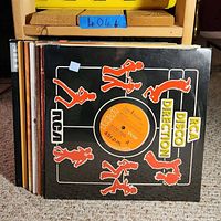 Front view of RCA Disco Direction 45 rpm vinyl single in black sleeve with red dancing figures and orange RCA Victor label.