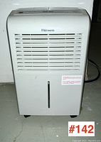 Front view of Premiere dehumidifier showing air vents and water level window on tank.