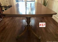 Front view of full table showing rectangular top and twin pedestals