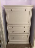 Front view of closed secretary desk showing overall condition and design