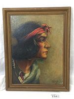 Full view of the framed oil painting showing profile of Navajo subject and surrounding wood frame