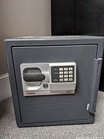 Front view of safe showing keypad, handle and lock