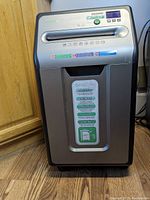 Front view of the GoECOlife paper shredder showing control panel, paper slot, and feature labels.