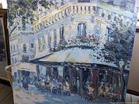 Front view of textured canvas print featuring a street cafe scene and signature F. Novarino at bottom left.