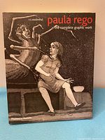 Front cover of the book featuring a figurative graphic artwork in dark tones showing a girl and a skeleton figure.