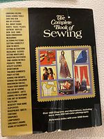 Front cover of 'The Complete Book of Sewing' showing title, sewing topics covered and images from the book, with visible wear on the edges.