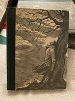 Front cover of the book showing detailed wood engraving illustration on the cover.