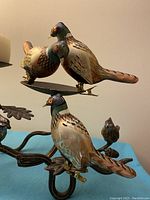 Three glass pheasant Christmas ornaments clipped on a metal stand (stand not included in sale) showing size and design details