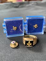Overview of ring and three pins in blue display boxes